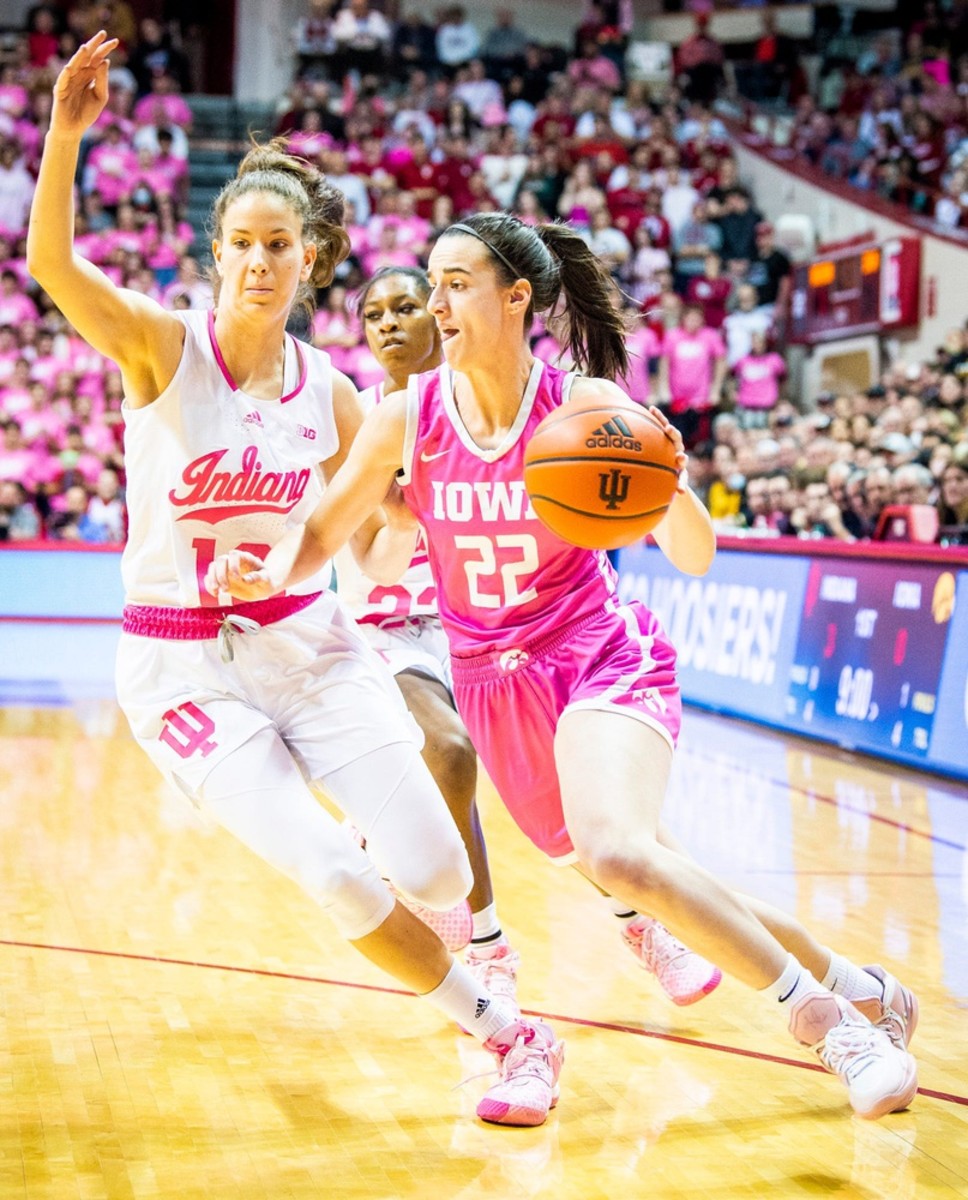 Iowa's Caitlin Clark (22) drives on Indiana's Yarden Garzon (12) during the first half of the Indiana versus Iowa women's basketball at Simon Skjodt Assembly Hall on Thursday, Feb. 9, 2023.