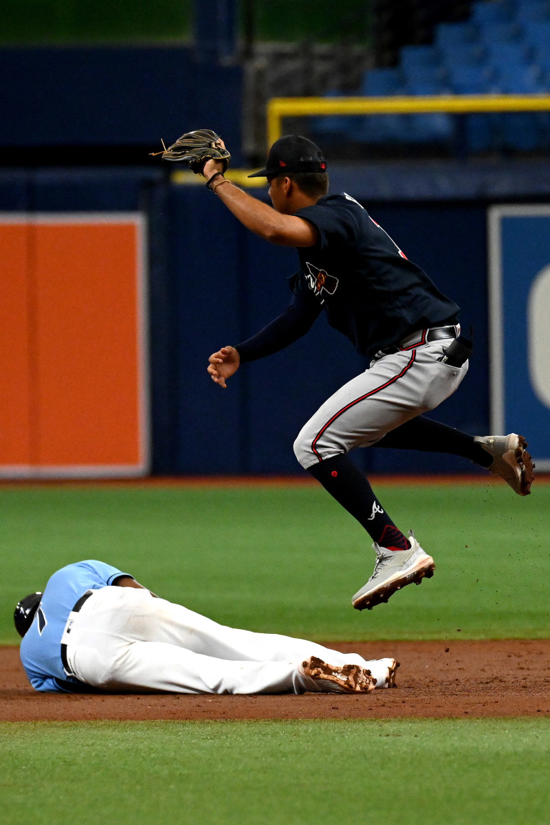 Mar 10, 2023; St. Petersburg, Florida, USA; Atlanta Braves shortstop Vaughn Grissom (18) leaps over Tampa Bay Rays short stop Vidal Brujan (7) in the second inning of a spring training game at Tropicana Field. Mandatory Credit: Jonathan Dyer-USA TODAY Sports
