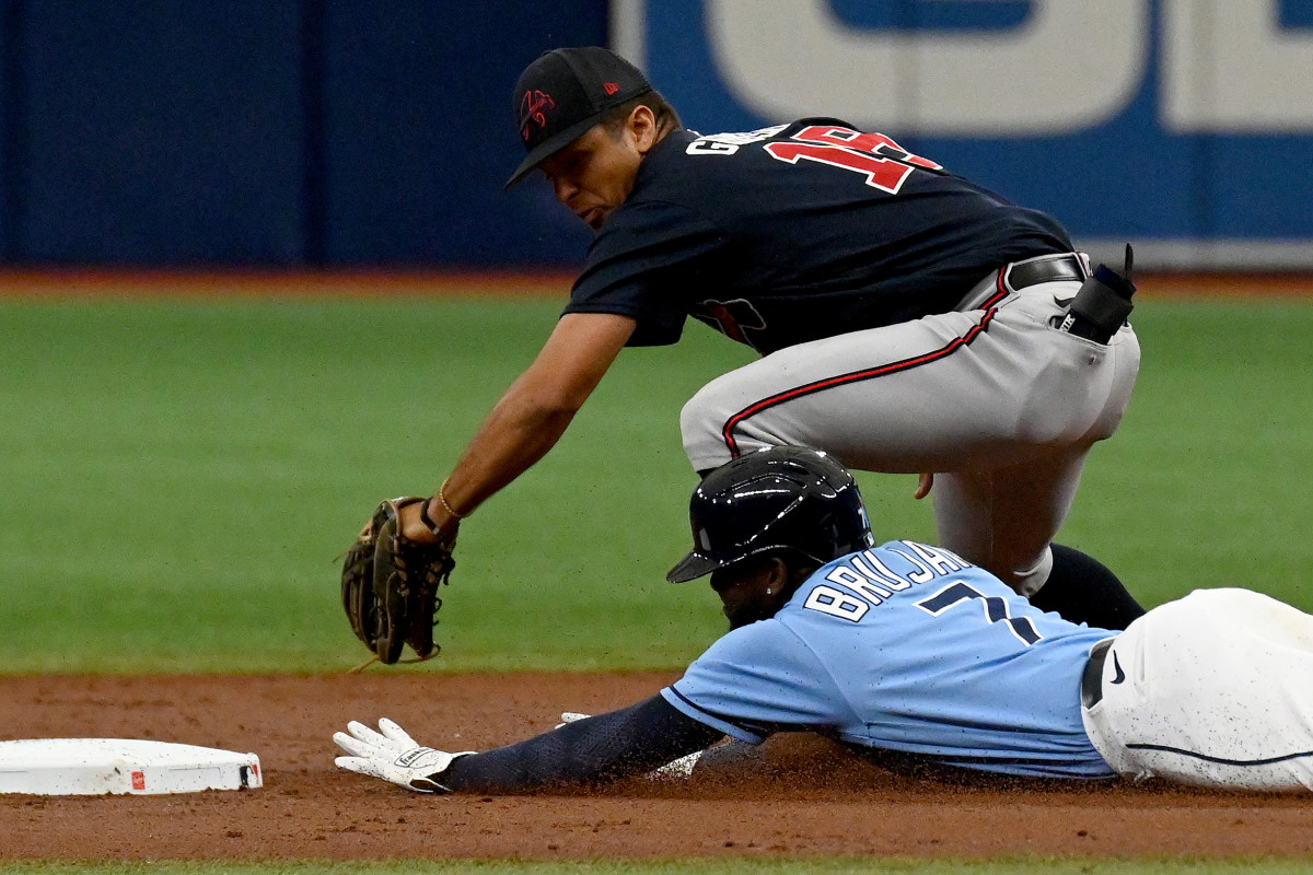 Mar 10, 2023; St. Petersburg, Florida, USA; Tampa Bay Rays short stop Vidal Brujan (7) slides into second base as Atlanta Braves shortstop Vaughn Grissom (18) places the tag in the second inning of a spring training game at Tropicana Field. Mandatory Credit: Jonathan Dyer-USA TODAY Sports