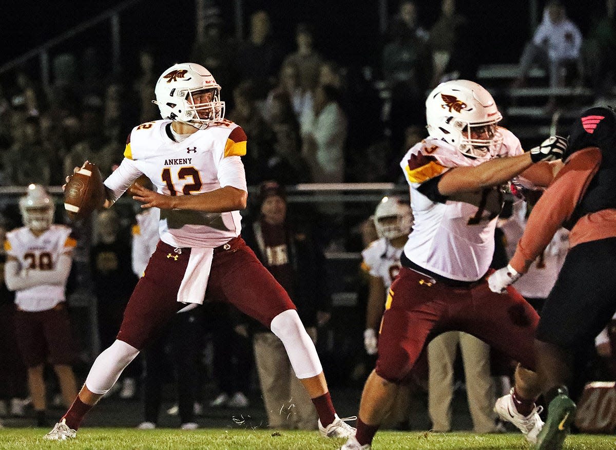 Ankeny High senior quarterback and ISU recruit JJ Kohl (12) spots an open receiver as the Ankeny Hawks compete against the North High Polar Bears on Friday, October 7, 2022, at Grubb Stadium in Des Moines. Dsm1009hawks A