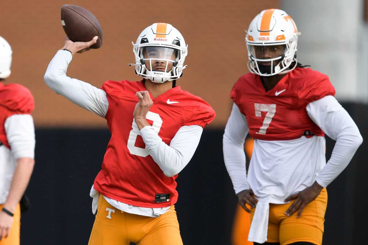 Tennessee quarterback Nico Iamaleava (8) throws a pass beside Tennessee quarterback Joe Milton III (7) during Tennessee football practice at Haslam Field in Knoxville, Tenn., on Saturday, Dec. 17, 2022. The Vols are preparing to play in the Orange Bowl against Clemson on Dec. 30. Ut Football Practice