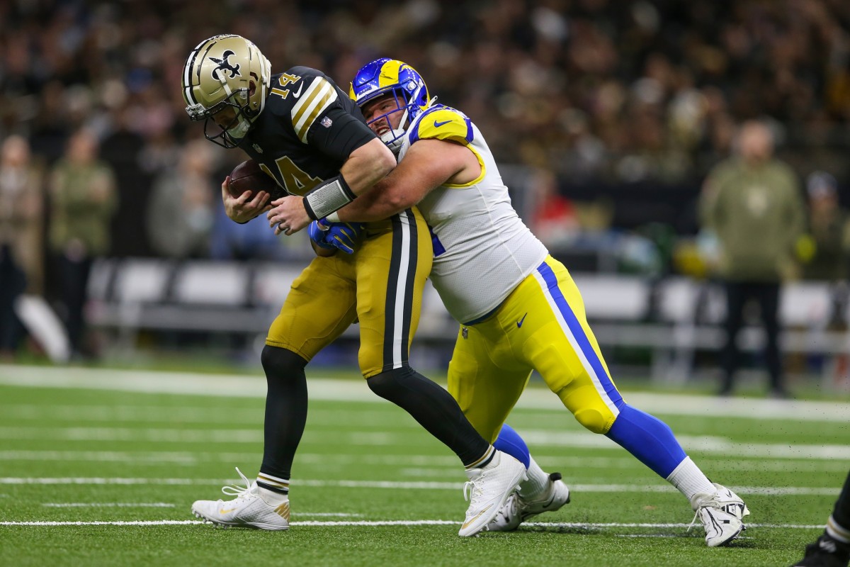 New Orleans Saints quarterback Andy Dalton (14) is sacked by Los Angeles Rams defensive tackle Greg Gaines (91). Mandatory Credit: Chuck Cook-USA TODAY