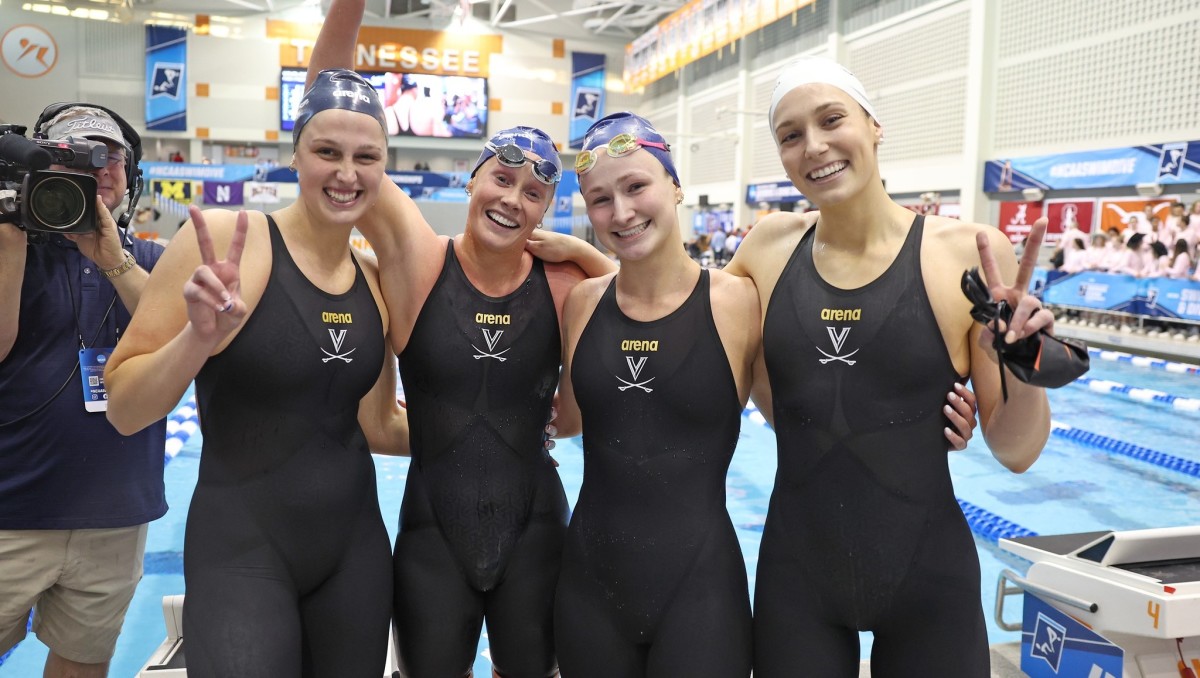 Aimee Canny, Ella Nelson, Reilly Tiltmann, and Alex Walsh celebrate after winning the NCAA title in the 800-yard freestyle relay at the 2023 NCAA Women's Swimming & Diving Championships at the Allan Jones Aquatic Center in Knoxville, Tennessee.