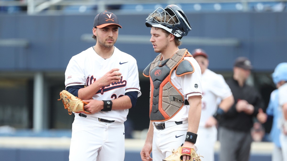 Nick Parker and Kyle Teel meet on the pitcher's mound during the Virginia baseball game against Columbia at Disharoon Park.