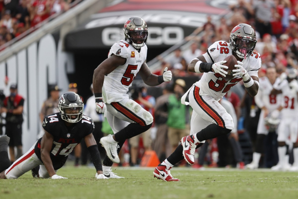 Sep 19, 2021; Tampa Bay Buccaneers safety Mike Edwards (32) runs an interception back for a touchdown against the Atlanta Falcons. Mandatory Credit: Kim Klement-USA TODAY