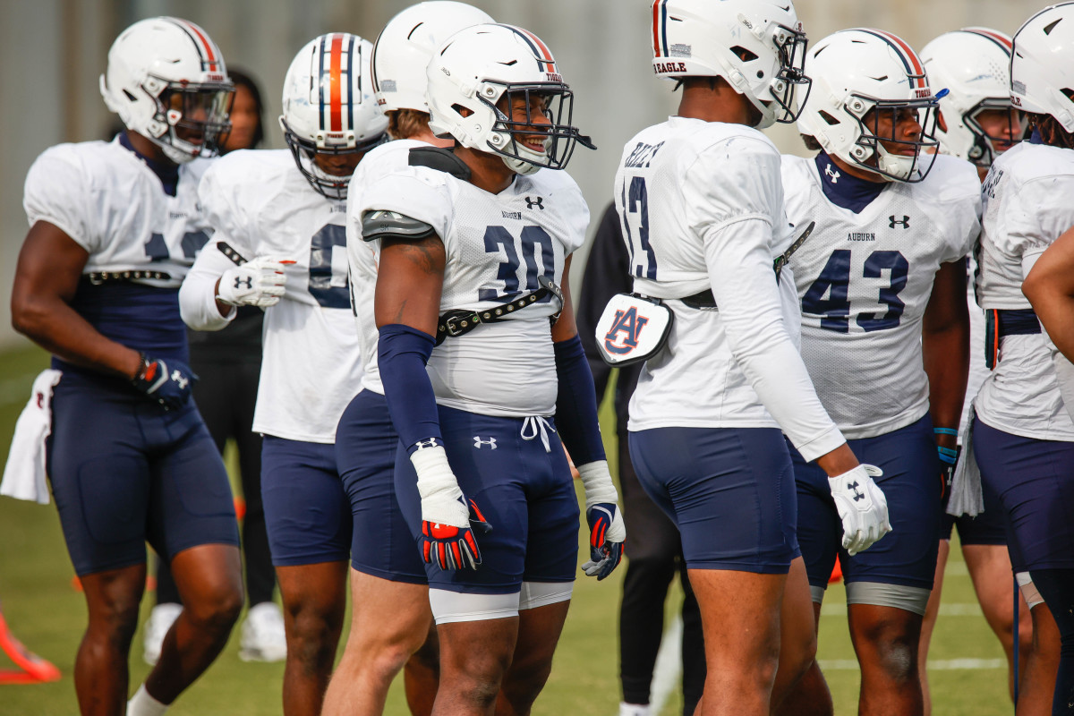 Auburn football linebackers Dylan Brook, Kam Brown, and Cam Riley