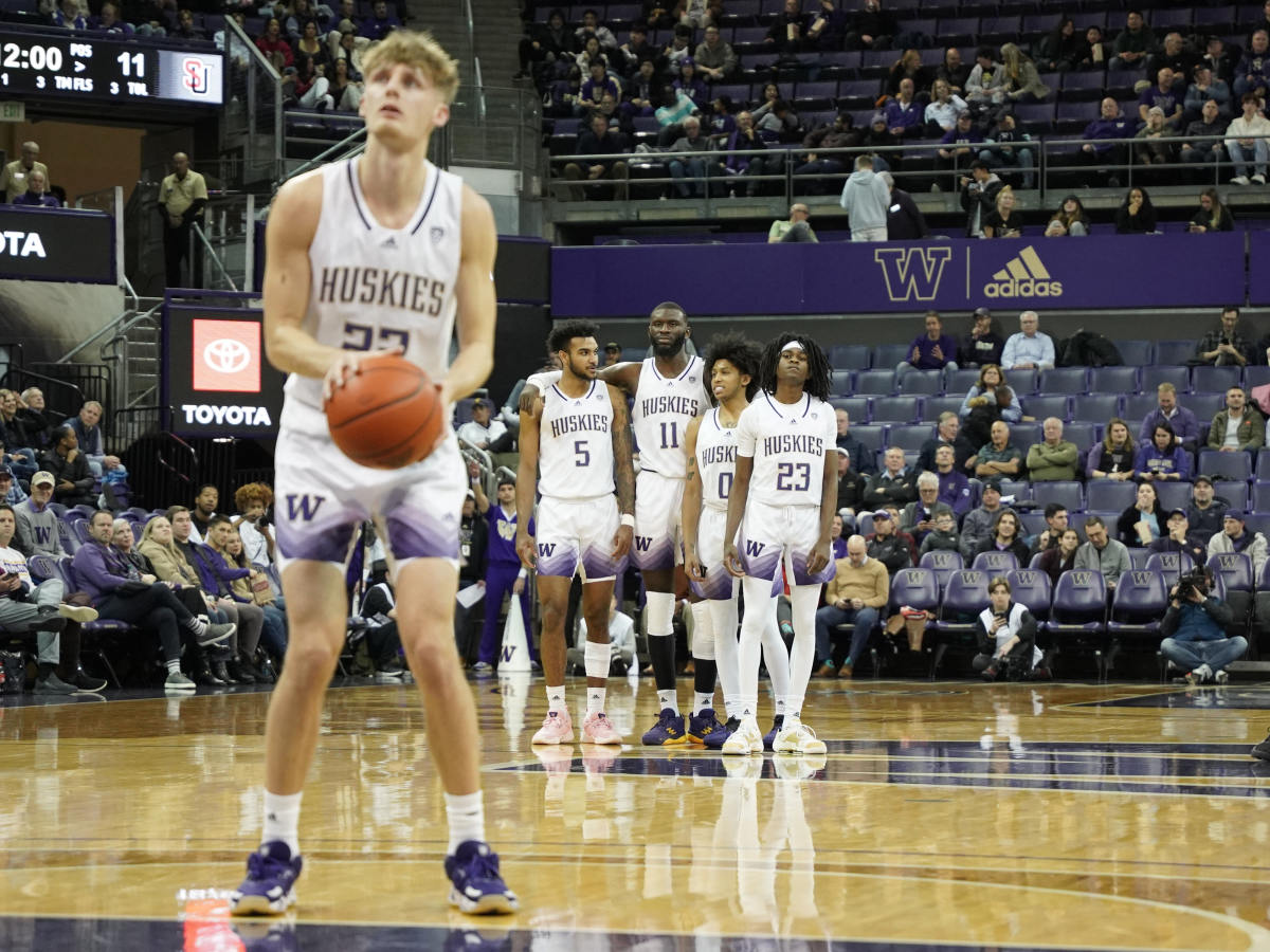 Cole Bajema takes aim at a technical foul shot as his teammates watch.