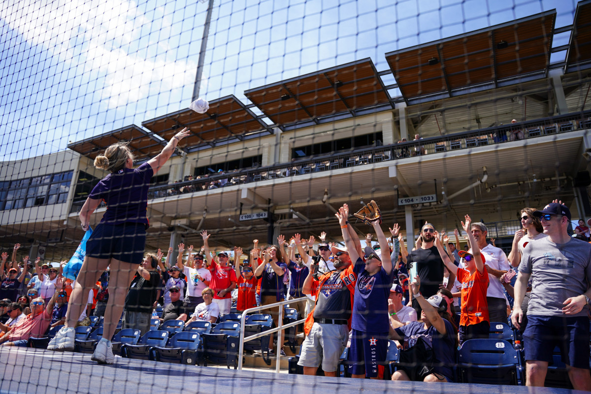 Houston Astros mascot , Orbit, waves to fans before a spring