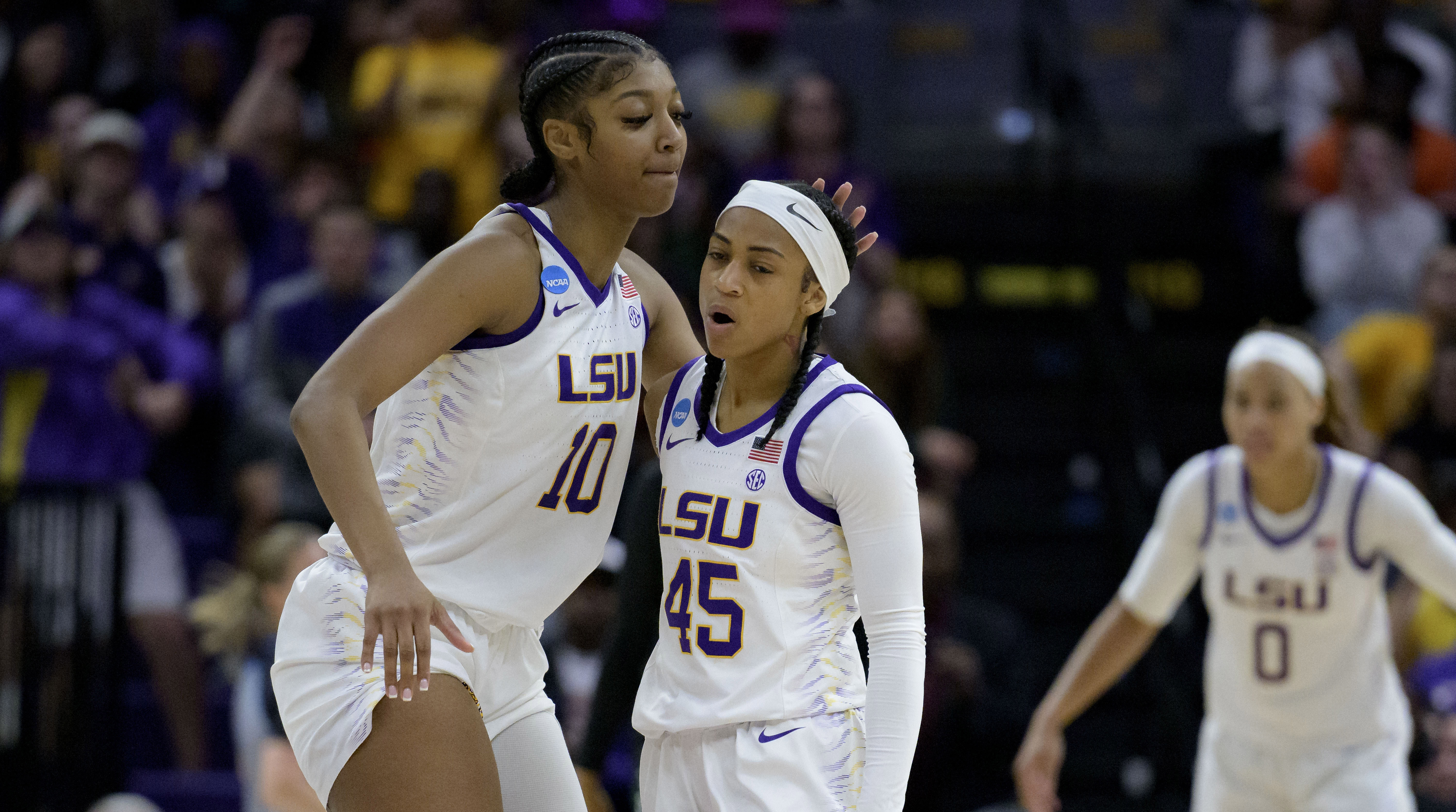 LSU forward Angel Reese celebrates with guard Alexis Morris.