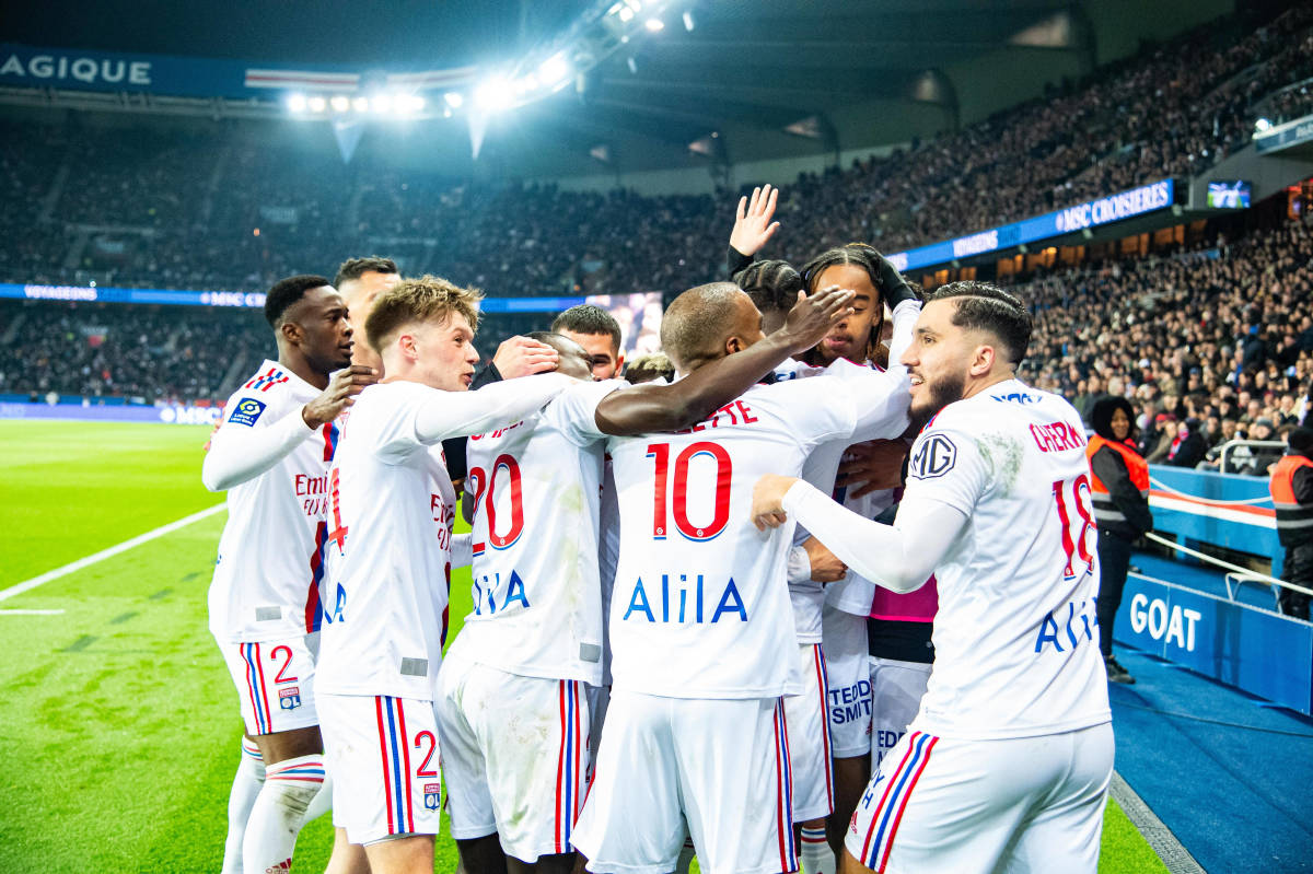 Players from Lyon pictured celebrating during a 1-0 win at PSG in April 2023