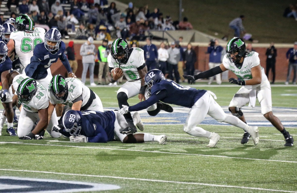 Marshall running back Khalan Laborn runs past Georgia Southern safety Anthony Wilson (12) on Saturday night at Paulson Stadium in Statesboro. Vsmarshall2