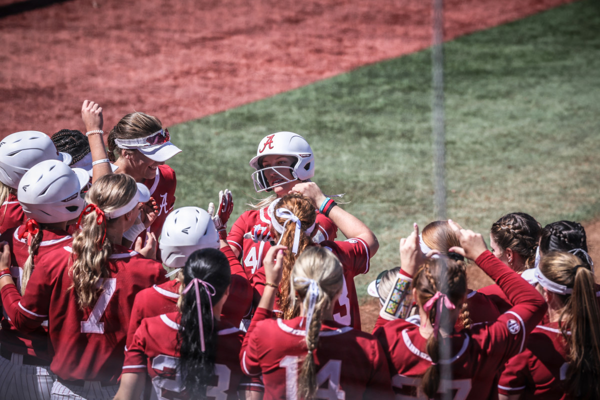 Alabama catcher Ally Shipman (34) is congratulated by teammates after hitting a home run against the Missouri Tigers on April 2, 2023 at Mizzou Softball Stadium in Columbia, Mo.