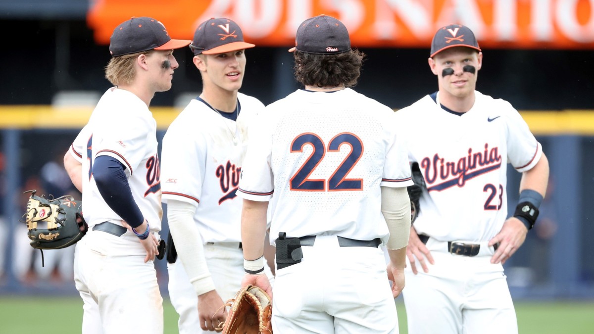 Griff O'Ferrall, Henry Godbout, Jake Gelof, and Ethan Anderson stand on the pitcher's mound during the Virginia baseball game against Florida State at Disharoon Park.