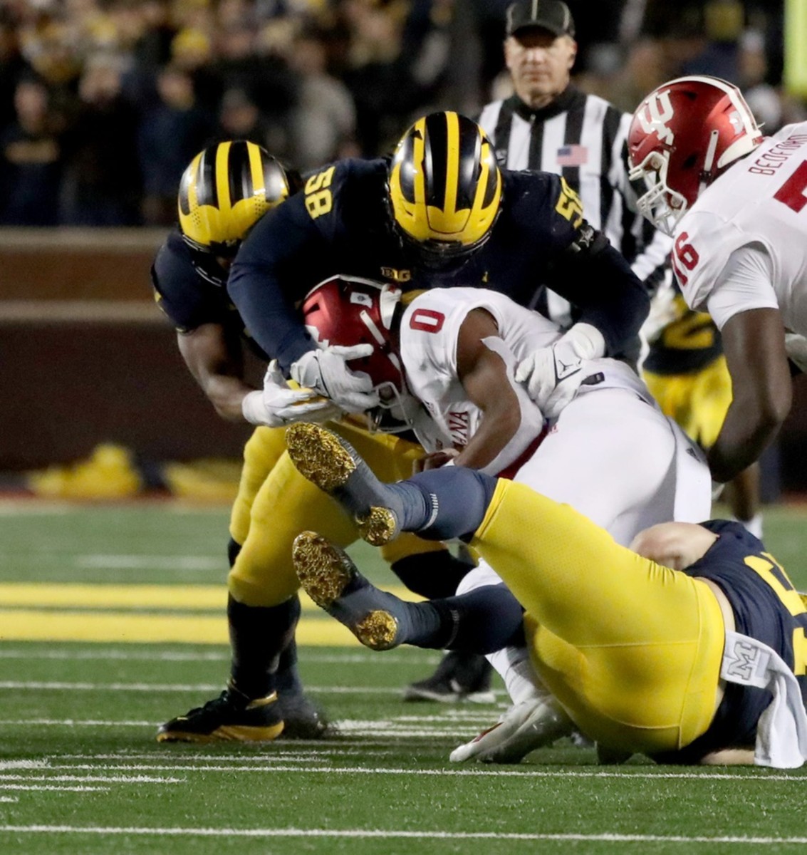 Michigan Wolverines defensive lineman Mazi Smith (58) tackles Indiana Hoosiers quarterback Donaven McCulley (0). © Kirthmon F. Dozier / USA TODAY NETWORK