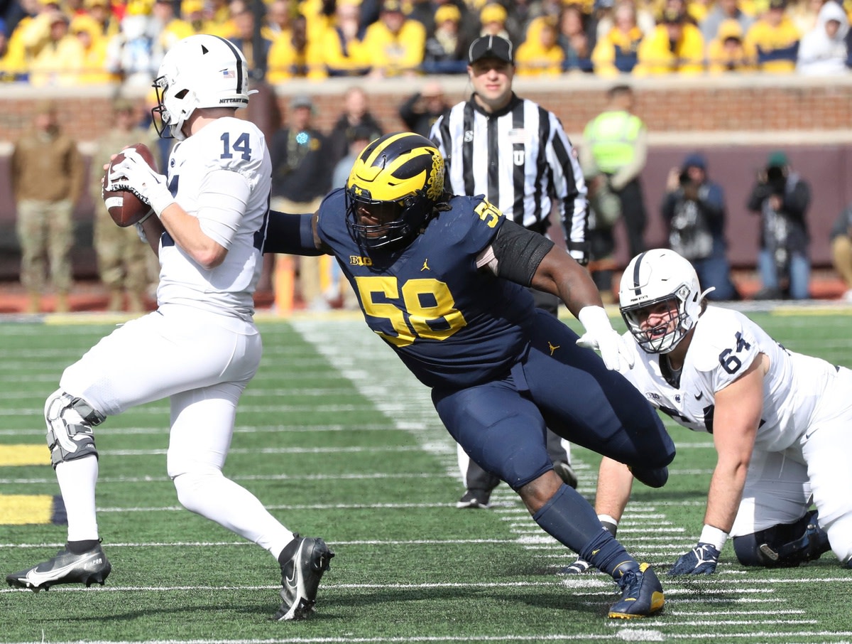 Michigan defensive lineman Mazi Smith (58) pressures Penn State quarterback Sean Clifford (14). © Kirthmon F. Dozier / USA TODAY NETWORK