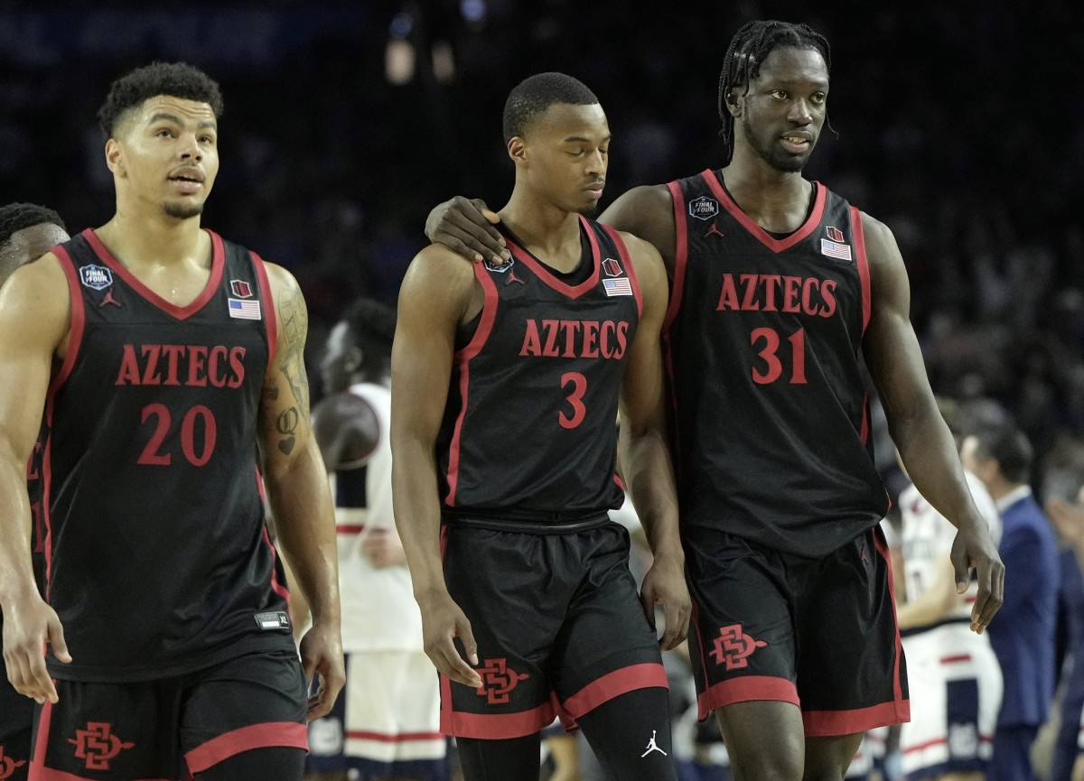 Matt Bradley, left, and teammates Micah Parrish and Nathan Mensah