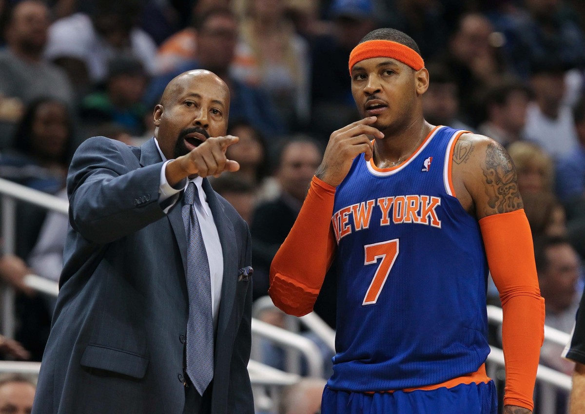 New York Knicks head coach Mike Woodson talks with small forward Carmelo Anthony (7) during the second quarter at Amway Center on Jan. 5 2013.