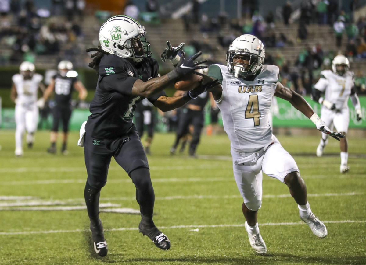 Nov 13, 2021; Huntington, West Virginia, USA; UAB Blazers cornerback Starling Thomas V (4) breaks up a pass intended for Marshall Thundering Herd wide receiver Willie Johnson (1) during the fourth quarter at Joan C. Edwards Stadium. Mandatory Credit: Ben Queen-USA TODAY Sports