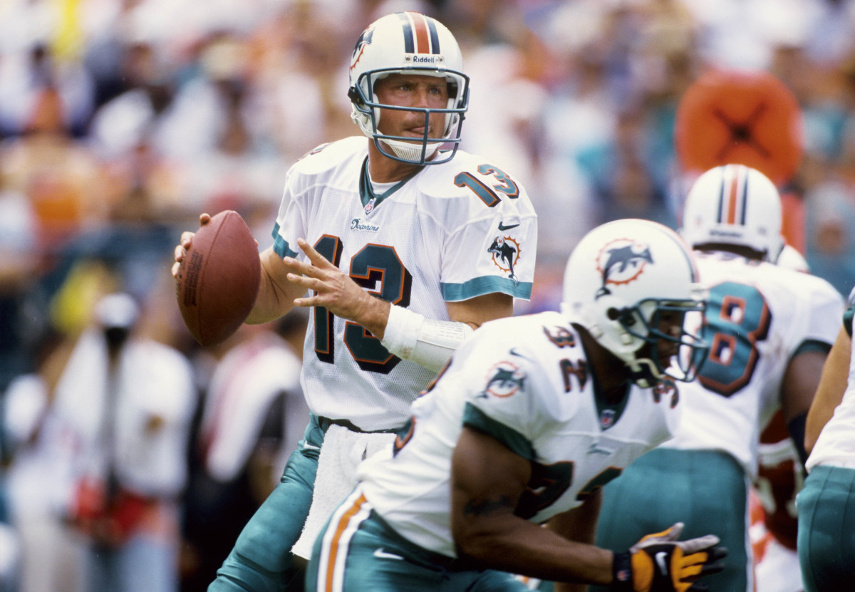 former Miami Dolphins quarterback Dan Marino holds the ball before throwing