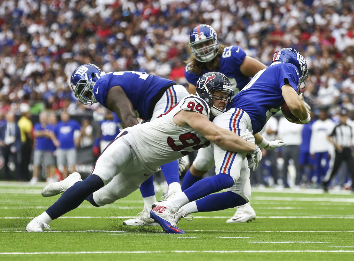 Houston Texans defensive end J.J. Watt dives to sack Eli Manning