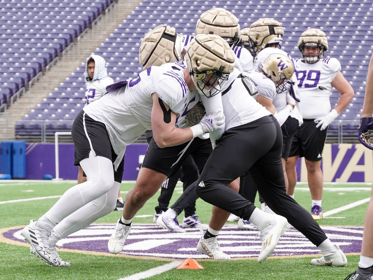 Zach Durfee runs through a defensive drill in Husky Stadium.