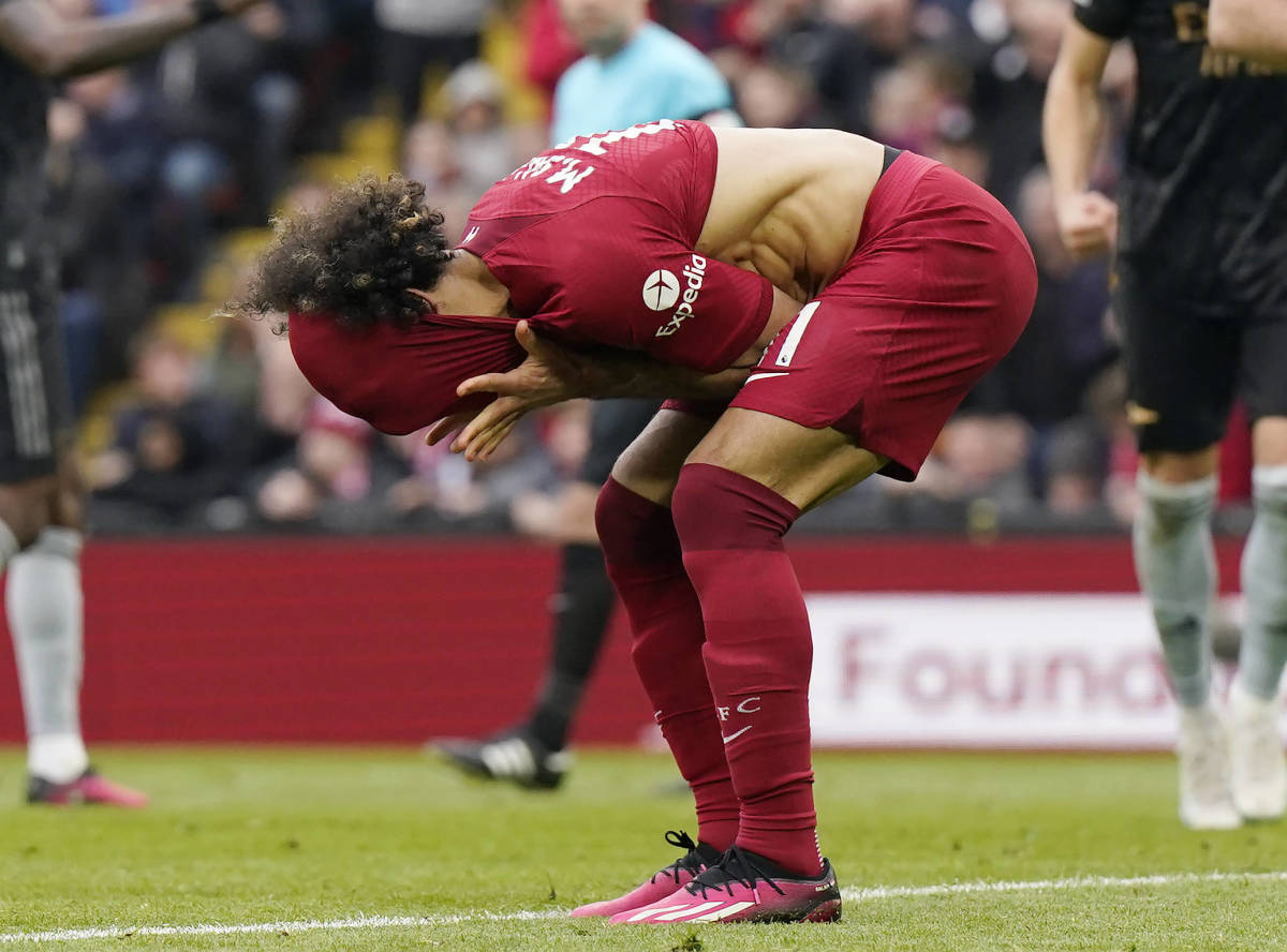 Liverpool forward Mo Salah pictured covering his face after missing a penalty kick against Arsenal in April 2023