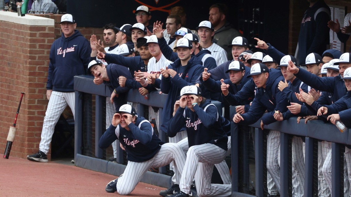 The Virginia baseball team reacts on the bench during game 2 against Miami at Disharoon Park.