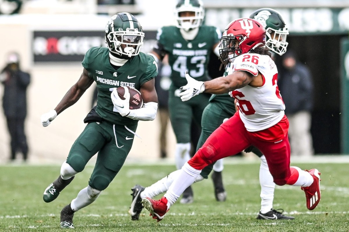 Michigan State's Jayden Reed returns a kick as Indiana's Josh Henderson closes in during the second quarter on Saturday, Nov. 19, 2022, at Spartan Stadium in East Lansing. 221119 Msu Indiana 124a