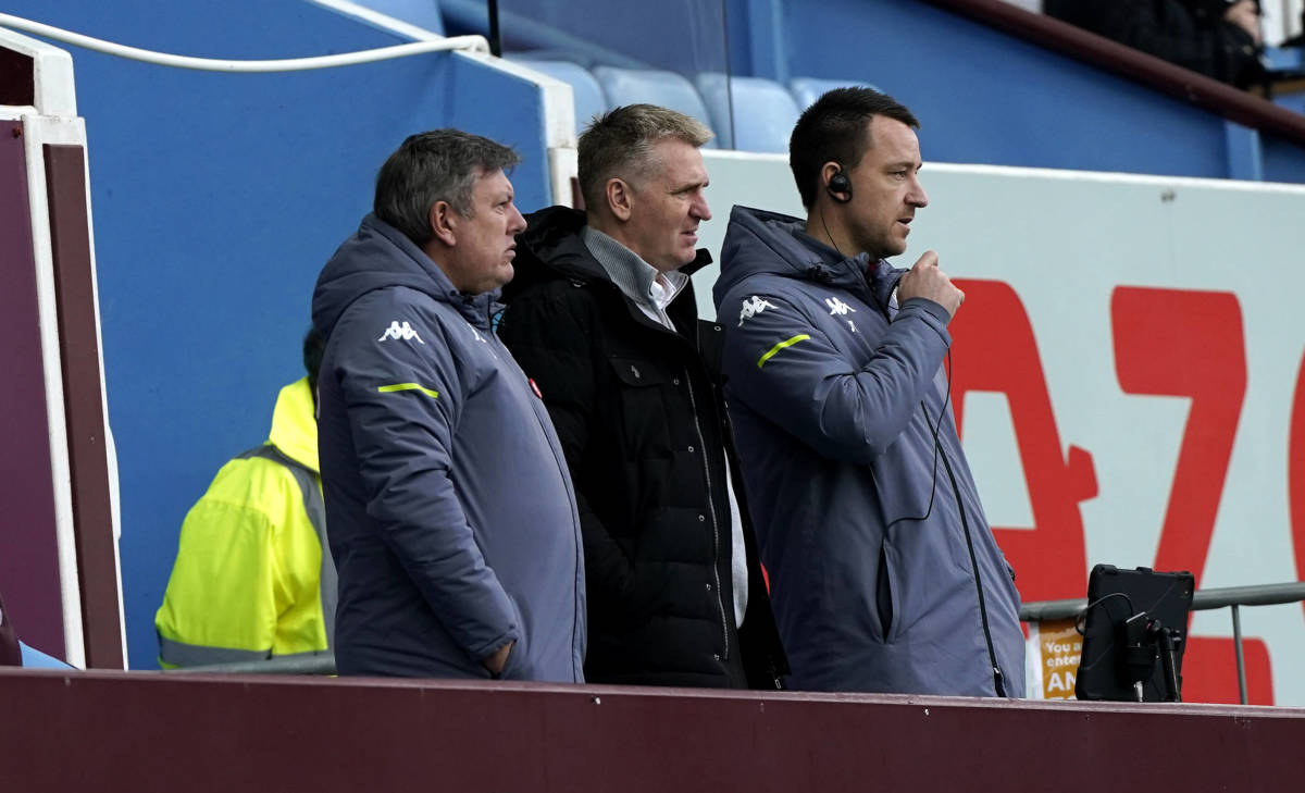 Dean Smith pictured (center) alongside Craig Shakespeare (left) and John Terry (right) in February 2021