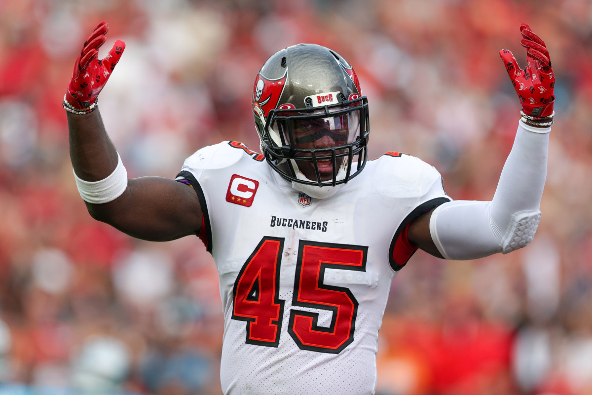 Devin White raises hands in celebration after play against the Carolina Panthers in 2022.