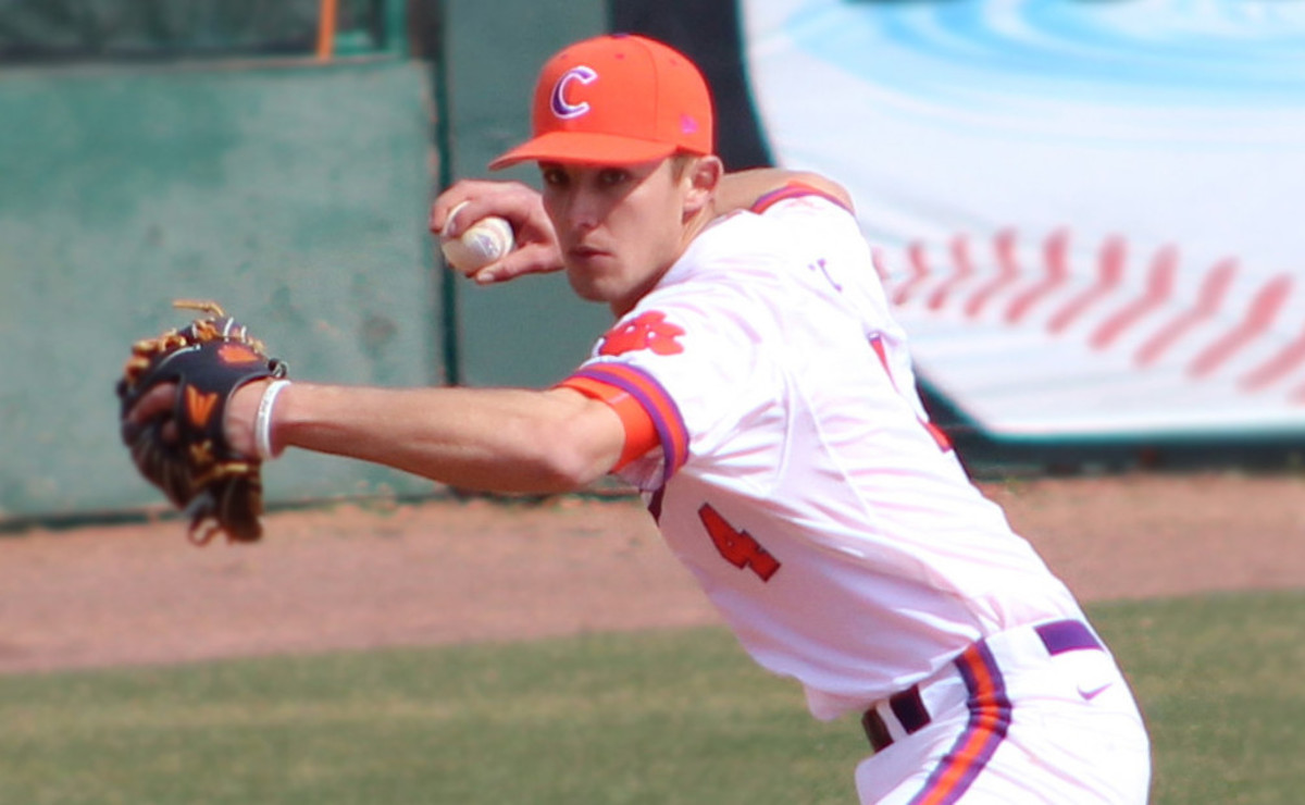 infielder Eli White (4) of the Clemson Tigers makes a bad throw to