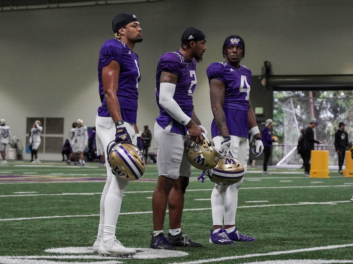 Rome Odunze, Ja'Lynn Polk and Germie Bernard hang together inside Dempsey Indoor.