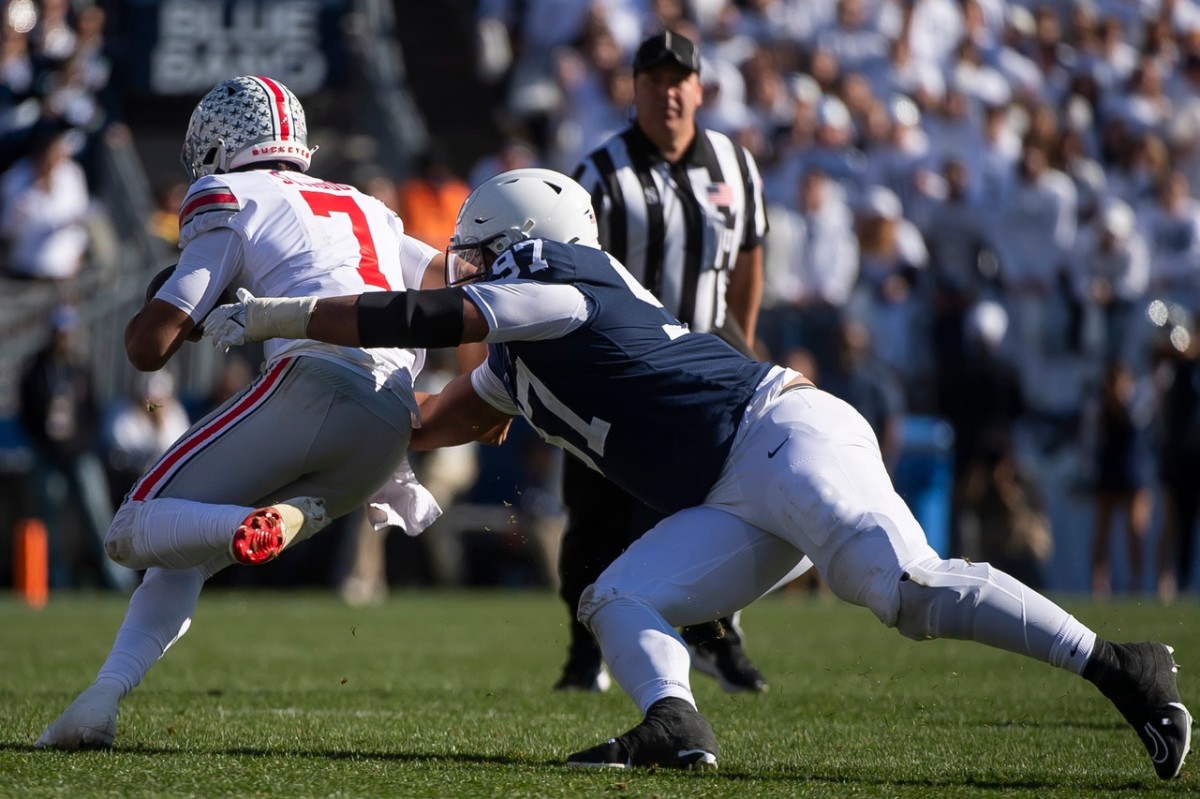 Penn State defensive tackle PJ Mustipher (97) tackles Ohio State quarterback C.J. Stroud after a short run in the third quarter against Ohio State at Beaver Stadium on Saturday, Oct. 29, 2022, in State College. The Nittany Lions fell to the Buckeyes, 44-31. Hes Dr 102922 Psuosu