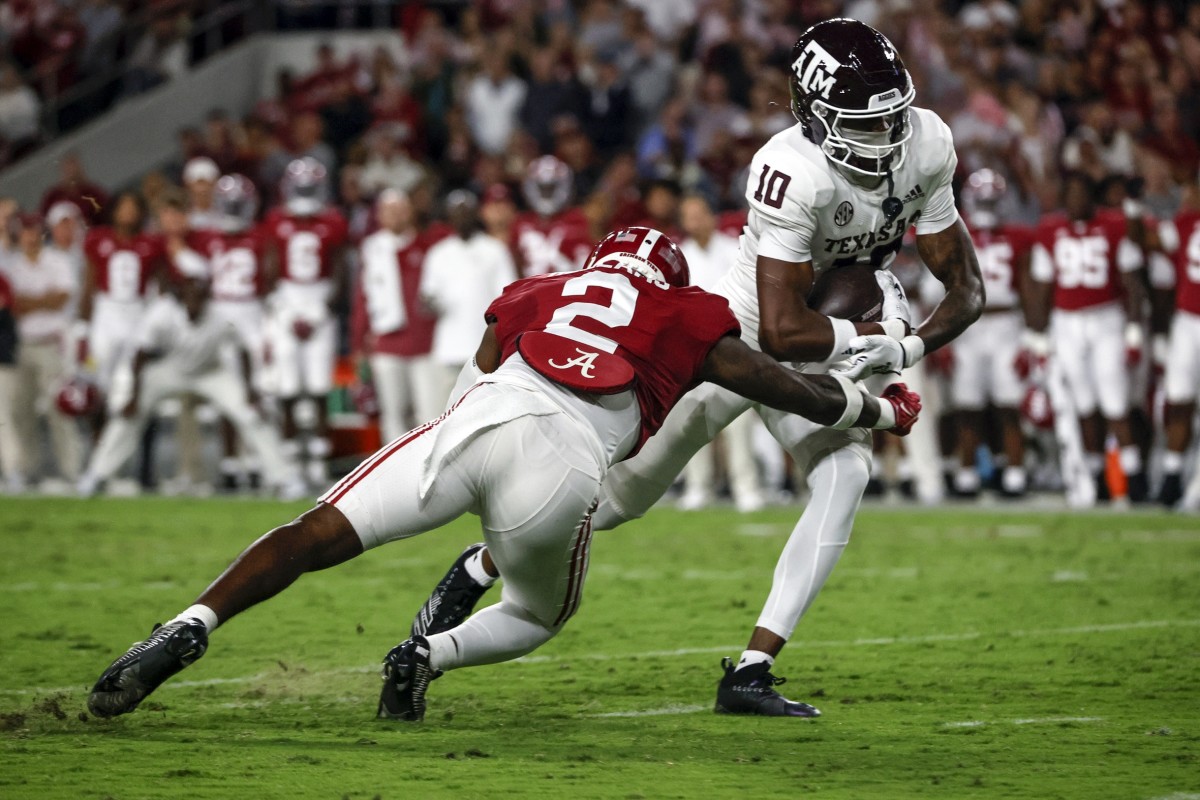 Oct 8, 2022; Tuscaloosa, Alabama, USA; Texas A&M Aggies wide receiver Chris Marshall (10) catches a pass against Alabama Crimson Tide defensive back DeMarcco Hellams (2) at Bryant-Denny Stadium. Mandatory Credit: Butch Dill-USA TODAY Sports