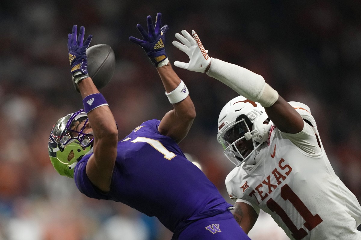 Dec 29, 2022; San Antonio, Texas, USA; Washington Huskies wide receiver Rome Odunze (1) attempts to catch the ball against Texas Longhorns defensive back Anthony Cook (11) in the first half of the 2022 Alamo Bowl at Alamodome. Mandatory Credit: Kirby Lee-USA TODAY Sports