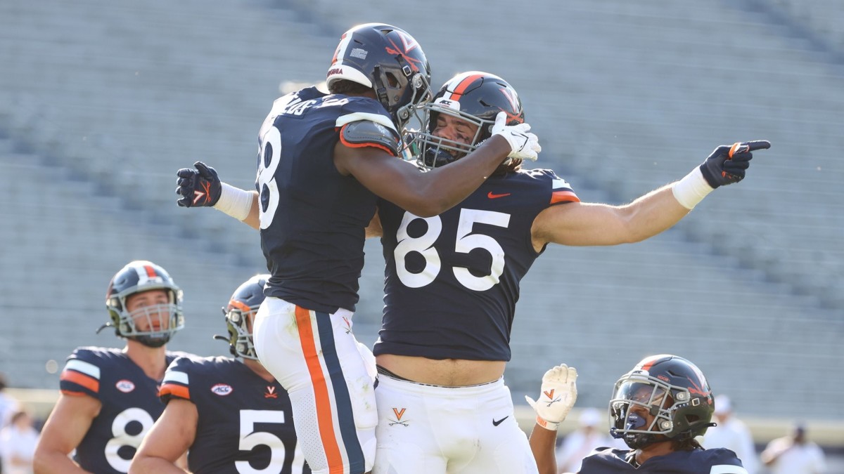 Malachi Fields and Grant Misch celebrate after scoring a touchdown during the Virginia football spring game.