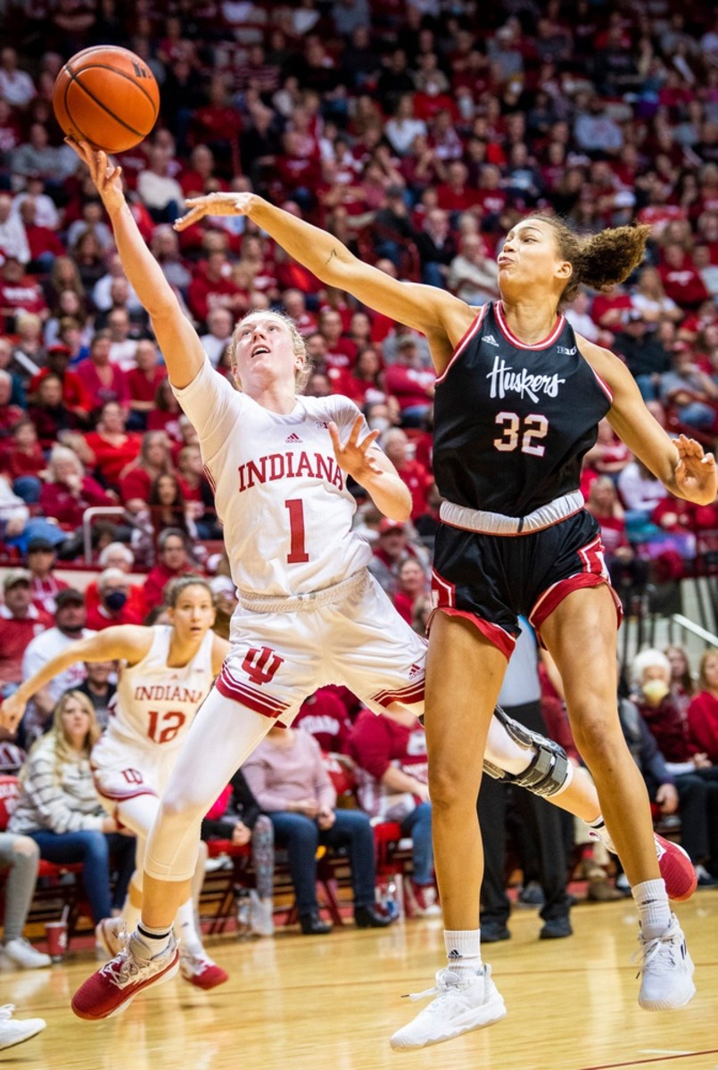 Indiana's Lexus Bargesser (1) scores past Nebraska's Kendall Coley (32) during the second half of the Indiana versus Nebraska women's basketball game at Simon Skjodt Assembly Hall on Sunday, Jan. 1, 2023.