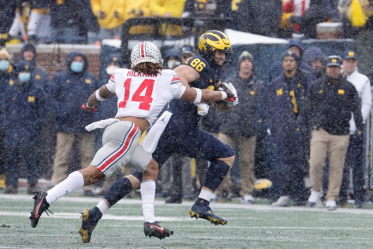 Nov 27, 2021; Michigan Wolverines tight end Luke Schoonmaker (86) after a catch against Ohio State Buckeyes safety Ronnie Hickman (14). Mandatory Credit: Rick Osentoski-USA TODAY