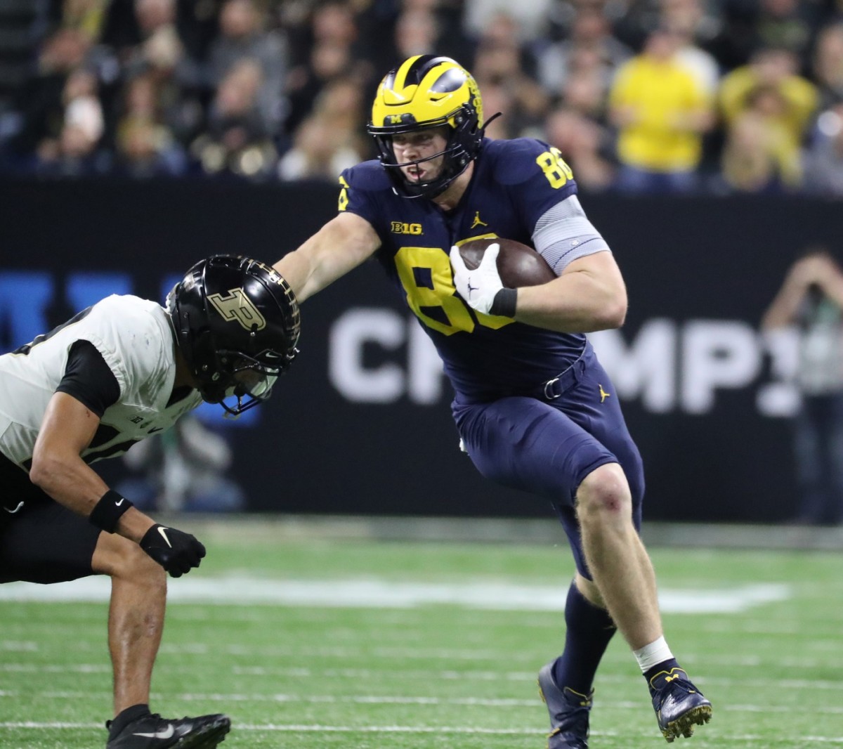 Michigan Wolverines tight end Luke Schoonmaker (86) makes a catch against Purdue Boilermakers safety Cam Allen (10) during the Big Ten Championship. Kirthmon F. Dozier / USA TODAY NETWORK