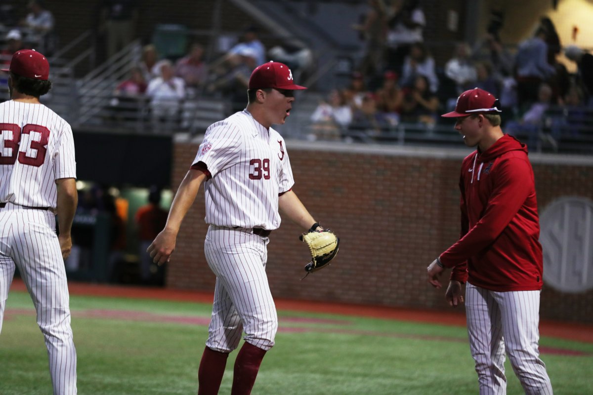 Alabama RHP Garrett McMillan (39) walks off the field with excitement in the Crimson Tide's 4-2 win over the Auburn Tigers on April 15, 2023 at Sewell-Thomas Stadium in Tuscaloosa, Ala.