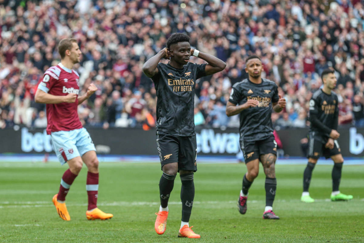 Bukayo Saka pictured (center) after missing a penalty kick during Arsenal's 2-2 draw against West Ham in April 2023