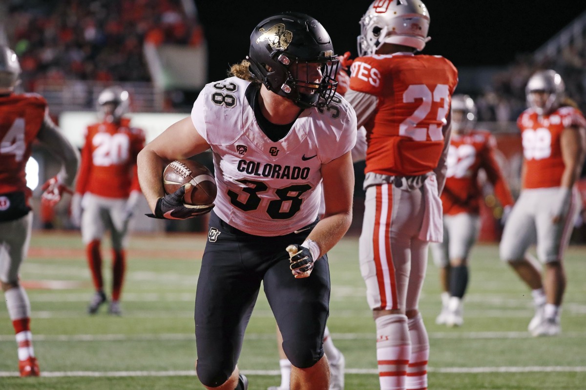 Nov 30, 2019; Salt Lake City, UT, USA; Colorado Buffaloes tight end Brady Russell (38) celebrates his touchdown against the Utah Utes in the first quarter at Rice-Eccles Stadium. Mandatory Credit: Jeff Swinger-USA TODAY Sports