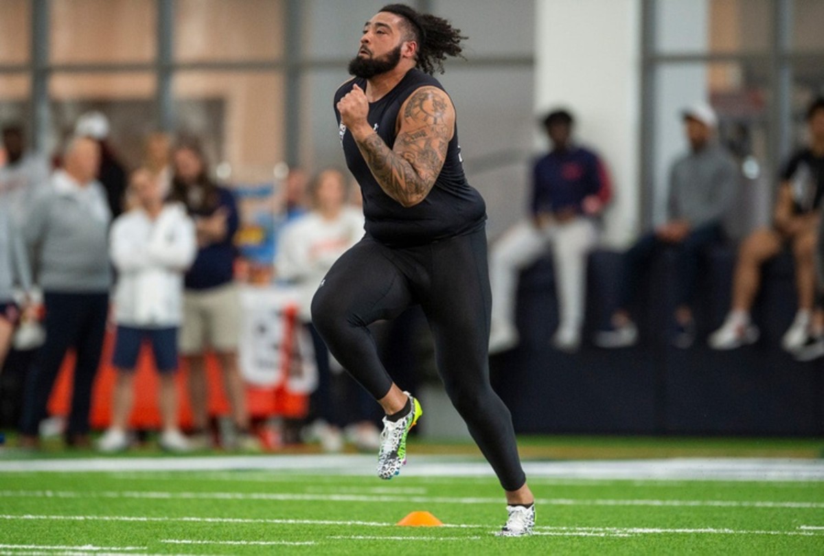 Auburn Tigers offensive lineman Brandon Council (71) runs the 40-yard-dash during Auburn Tigers Pro Day at Woltosz Football Performance Center in Auburn, Ala., on Tuesday, March 21, 2023.