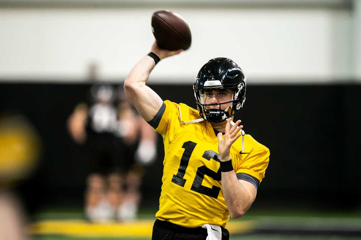 Iowa quarterback Cade McNamara (12) throws the ball during a spring NCAA football practice, Thursday, March 30, 2023, at the University of Iowa Indoor Practice Facility in Iowa City, Iowa. 230330 Iowa Spring Fb 001 Jpg