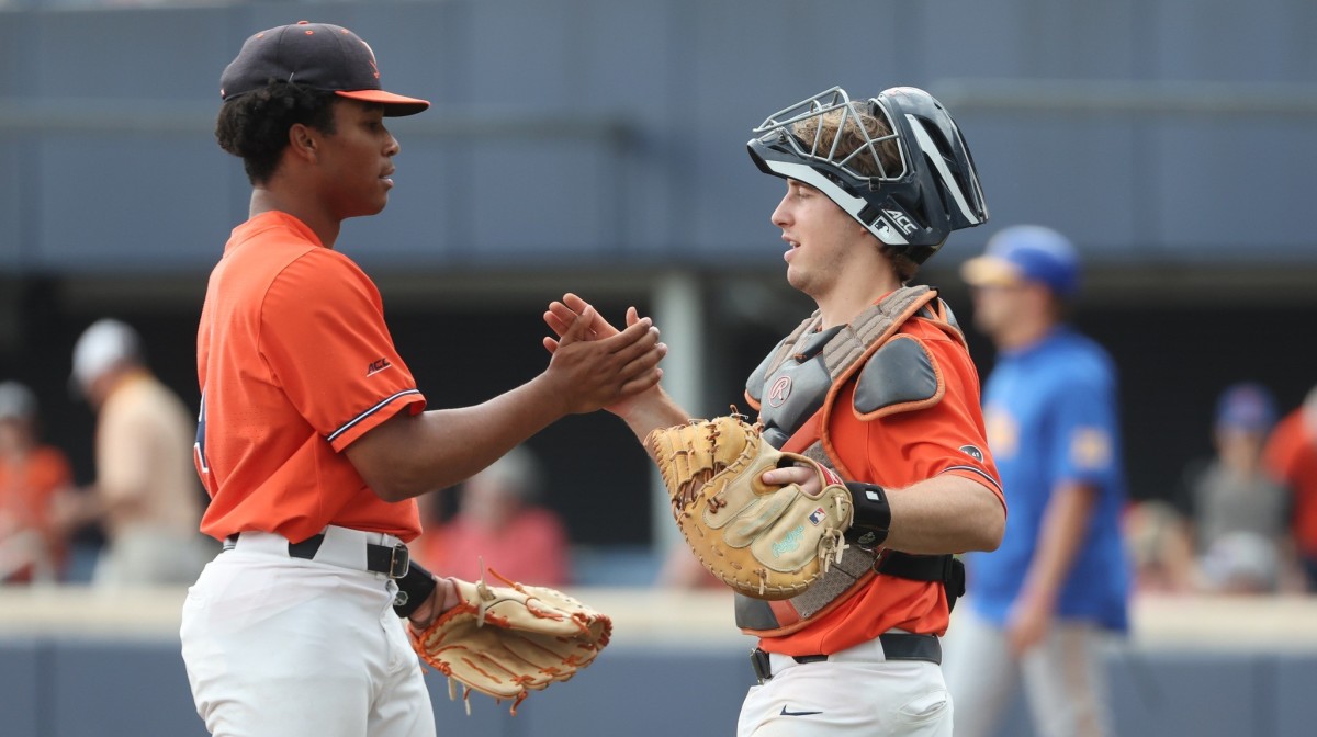 Jay Woolfolk and Kyle Teel shake hands on the mound after the Virginia baseball game against Pittsburgh at Disharoon Park.