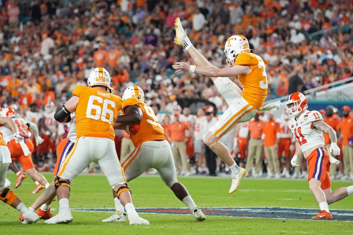 Dec 30, 2022; Miami Gardens, FL, USA; Tennessee Volunteers punter Paxton Brooks (37) punts during the first half of the 2022 Orange Bowl against the Clemson Tigers at Hard Rock Stadium. Mandatory Credit: Jasen Vinlove-USA TODAY Sports