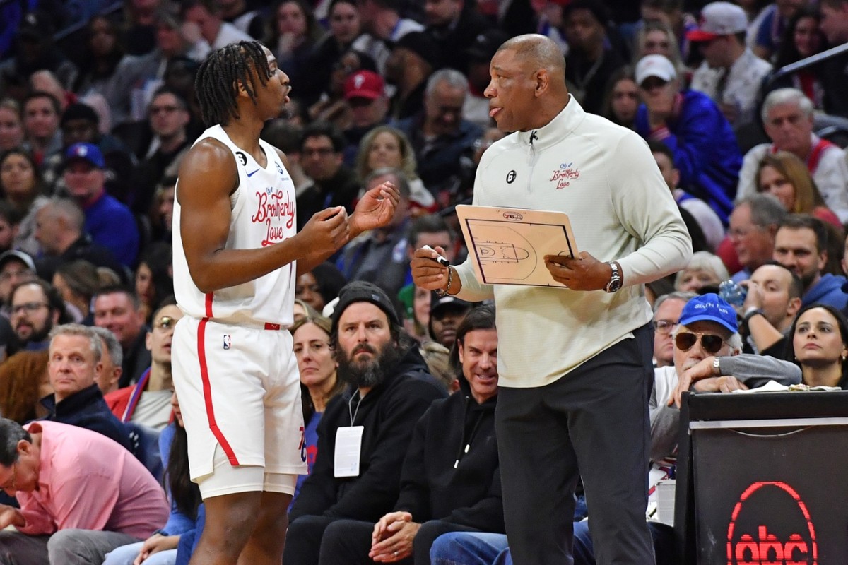 76ers head coach Doc Rivers talking to Tyrese Maxey.