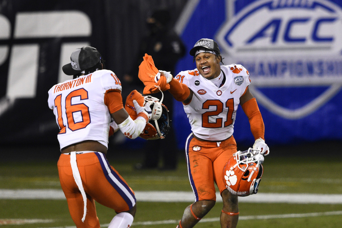 Clemson Tigers safety Ray Thornton III (16) and cornerback Malcolm Greene (21) celebrate after winning the ACC Football Championship at Bank of America Stadium.