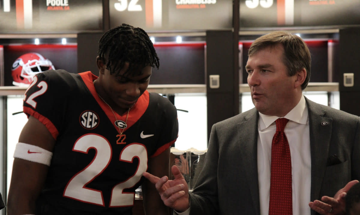 Georgia defensive back Marcus Washington with head coach Kirby Smart. 