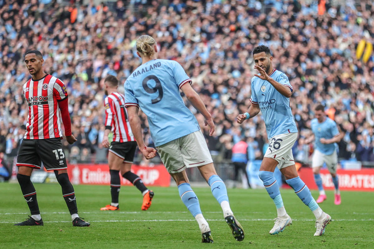 Riyad Mahrez pictured (right) celebrating with Erling Haaland after scoring a penalty kick for Manchester City against Sheffield United in an FA Cup semi-final in April 2023